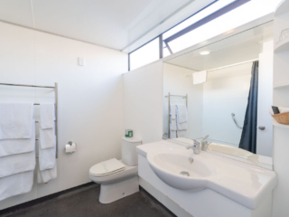 The Village Inn bathroom sink and mirror