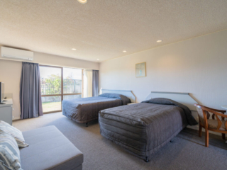 The Village Inn Te Anau double bedroom with sliding door