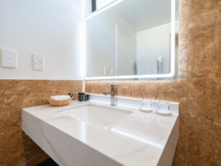 The Village Inn bathroom sink and mirror